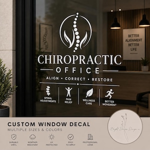 May include: A white vinyl window decal applied to glass, featuring a chiropractic logo with a spinal column icon, the text CHIROPRACTIC OFFICE, ALIGN CORRECT RESTORE, and four service icons with labels for spinal adjustments, pain relief, wellness care, and better movement.