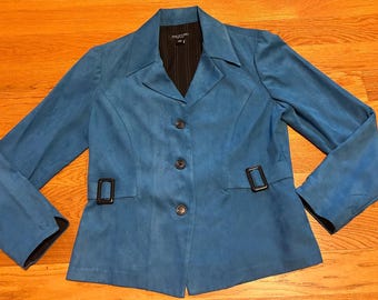 May include: Teal blazer with a notched collar, three buttons, and two black buckles. The jacket has long sleeves and a black pinstripe lining. A stylish and versatile outerwear piece.