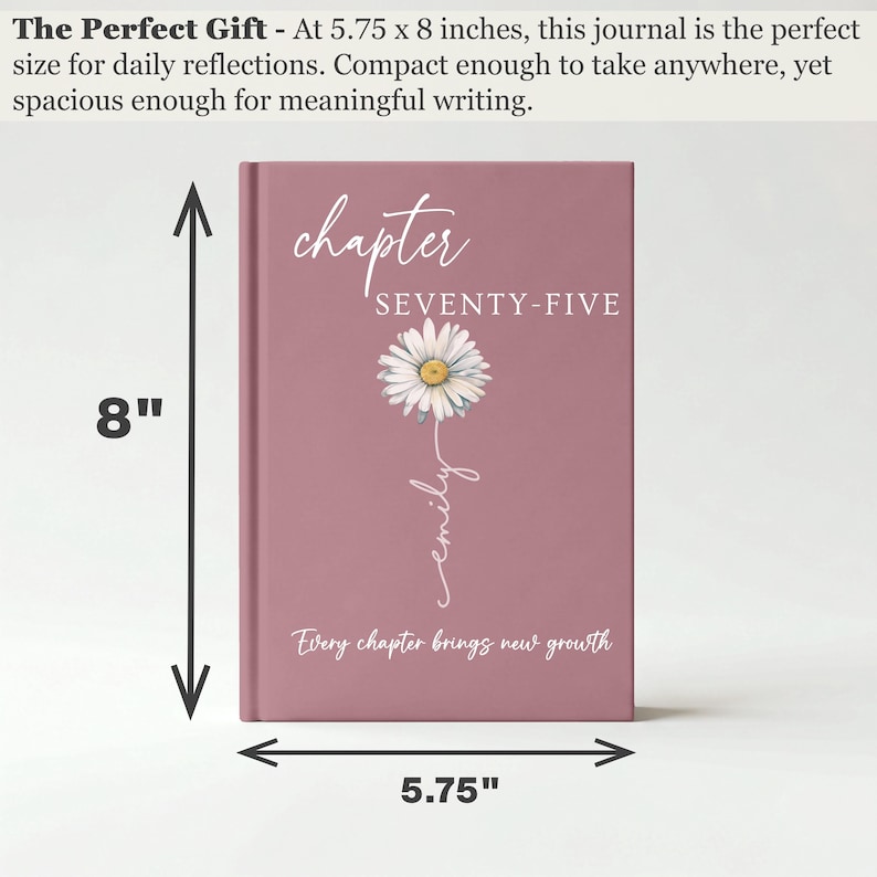 May include: A dusty rose journal measuring 5.75 by 8 inches. The cover features a white daisy illustration, the text "chapter SEVENTY-FIVE", the name "emily" in script, and the phrase "Every chapter brings new growth" in white lettering.