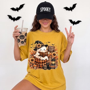 Cute Ghost Reading Book Shirt, Spooky Season Is Here Tee,Book Lover Halloween Shirt,Witchy Autumn Graphic Tee,Cozy Fall Ghost T-Shirt,unisex