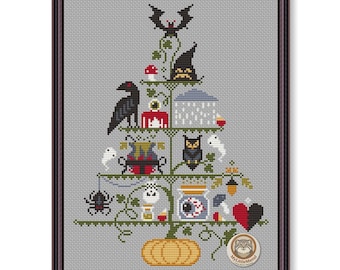 May include: A cross-stitch pattern on a gray background featuring a tree shape composed of various spooky elements including a pumpkin base, a black crow, a witch hat, a cauldron, a jar with an eyeball, a spider, ghosts, and a bat at the top.