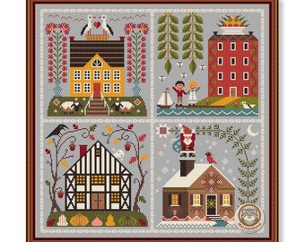 May include: A framed cross-stitch sampler featuring four detailed house scenes. The scenes include a yellow house with sheep, a red building with windows, a black and white house, and a Christmas scene with Santa Claus.