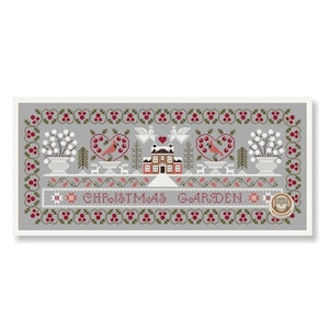 May include: A cross-stitch design featuring a Christmas Garden scene. The design includes a house, hearts, birds, and floral elements, all in shades of red, white, and green on a gray background. The words "CHRISTMAS GARDEN" are stitched across the center.