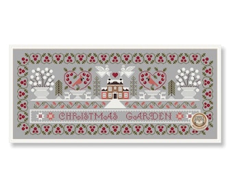 May include: A cross-stitch design featuring a Christmas Garden scene. The design includes a house, hearts, birds, and floral elements, all in shades of red, white, and green on a gray background. The words "CHRISTMAS GARDEN" are stitched across the center.