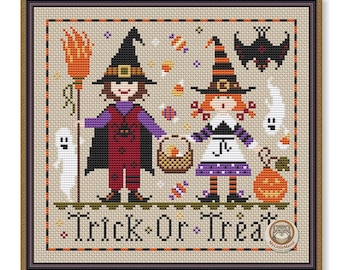 May include: Cross-stitch design featuring two witches, a ghost, a bat, and a jack-o'-lantern. The witches are holding a broom and a basket. The text "Trick or Treat" is stitched at the bottom. The design is framed in a brown border.