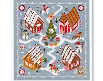 May include: Cross-stitch design of a winter village scene with gingerbread houses, snowmen, and people riding horses. The houses have white and pink roofs, and the scene is set on a light blue background. A Christmas tree and gifts are in the center.
