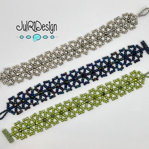 May include: Three beaded bracelets with intricate geometric patterns. The bracelets are silver, dark blue, and green.