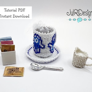 May include: A white beaded teacup and saucer with blue floral designs, a white beaded creamer, a silver spoon, a box of sugar sachets, and a single sugar sachet labelled "Sugar in the Raw" on a white surface. The text "Tutorial PDF Instant Download" is at the top of the image.