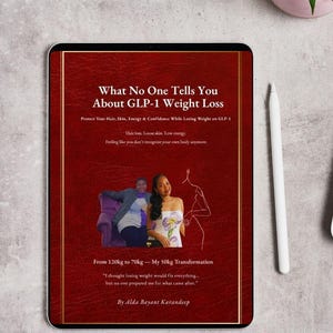 May include: A digital tablet displays a book cover titled "What No One Tells You About GLP-1 Weight Loss." The cover is red with gold accents and includes text about weight loss, hair, skin, and energy. A stylus and a small plant are visible.