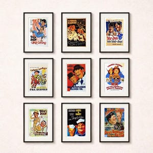 May include: Nine framed vintage movie posters featuring Laurel and Hardy. The posters have black frames and are arranged in a grid. The posters feature colorful illustrations and text in various languages, including German and French.