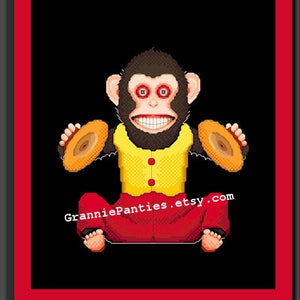 May include: A pixelated image of a monkey playing cymbals. The monkey is wearing a yellow shirt with red pants and has red eyes. The background is black. The text "GranniePanties.etsy.com" is at the bottom of the image.