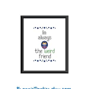 May include: A black framed picture with a white background and the text "I'm always the weird friend" in black and green text. A pixelated cartoon image of a person is in the middle of the text.