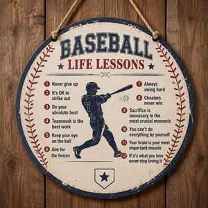 May include: A round, cream-colored wall sign with a distressed blue border and a rope hanger. It features the text BASEBALL LIFE LESSONS, a silhouette of a baseball player swinging a bat, and a numbered list of twelve inspirational phrases.
