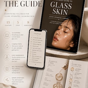 May include: An open book, tablet, and smartphone display the guide "Glass Skin" with text and diagrams about skincare. The image includes a serum bottle and jewelry, with the text "Everything you need for clear, hydrated, glowing skin."