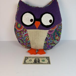 May include: A set of three ceramic mugs with a speckled, matte finish. The mugs are in shades of cream, light gray, and dark gray. Each mug has a simple, minimalist design, perfect for coffee or tea.