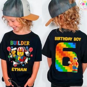 May include: A white ceramic mug with a black handle and the text "But First, Coffee" in a bold, black font. The mug is filled with a dark liquid, likely coffee, and sits on a light-colored surface.