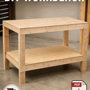 May include: A light-colored wooden workbench featuring a rectangular top and a lower storage shelf supported by four sturdy legs. The text DIY WORKBENCH is displayed at the top, and a PDF PLAN icon is visible in the bottom right corner.