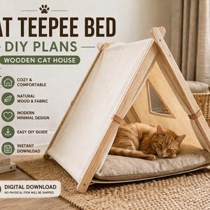 May include: A wooden cat teepee bed with a beige canvas cover and a light brown cat sleeping inside. The bed has a triangular shape with a window and is on a woven mat. Text on the image says "CAT TEEPEE BED - DIY PLANS - WOODEN CAT HOUSE".