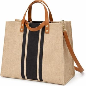 May include: A beige tote bag with a black vertical stripe design. The bag features brown leather handles and a detachable shoulder strap. The rectangular bag has a structured shape, suitable for everyday use.