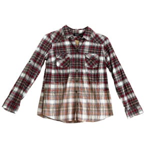 May include: A red, white, and gray plaid flannel shirt with a faded ombre effect. The shirt has a button-down front and long sleeves.