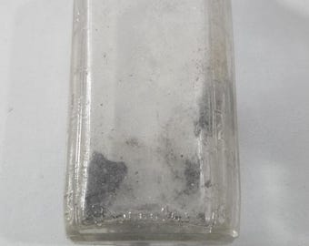 Frasco de medicina vintage de vidrio transparente Duraglass de los años 60 con marcas en relieve.