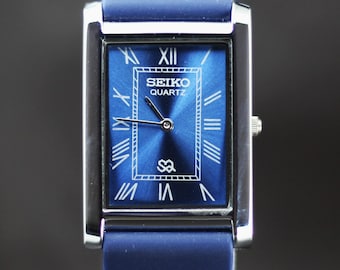 Reloj de pulsera Seiko Slim de cuarzo para hombre, reacondicionado, con esfera azul, fabricado en Japón.