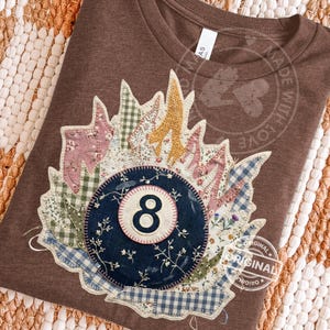 May include: A set of three ceramic mugs with a speckled, matte finish. Each mug features a different color: light blue, cream, and gray. The mugs have a simple, modern design and a comfortable handle. Perfect for coffee or tea.