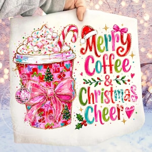 May include: A white fabric square featuring a graphic of a pink checkered coffee cup topped with whipped cream, marshmallows, and a candy cane. A large pink bow, a disco ball, and Christmas icons decorate the cup. Text reads Merry Coffee & Christmas Cheer.