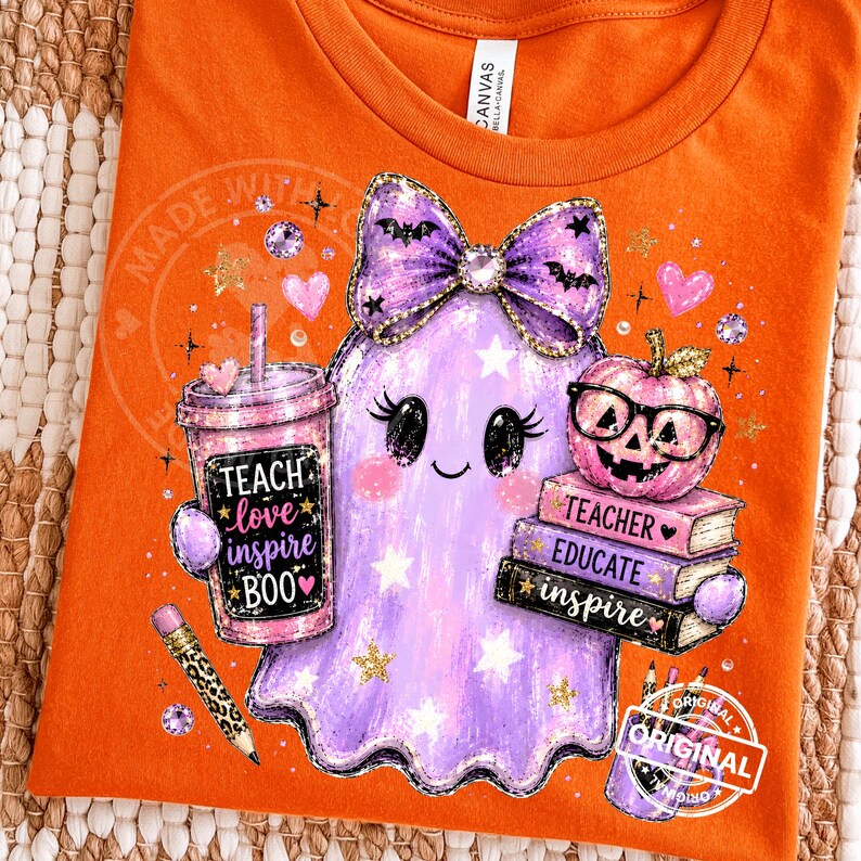 May include: An orange t-shirt featuring a graphic of a purple ghost wearing a bow, holding a tumbler with the text 'TEACH love inspire BOO', a stack of books labeled 'TEACHER', 'EDUCATE', 'inspire', a pumpkin with glasses, and a leopard print pencil.