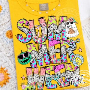 May include: Yellow t-shirt with the words "SUMMER WAVE" in a colorful, patchwork design. The design includes a ghost wearing sunglasses, a pumpkin with sunglasses, and a beach ball. The shirt also has the words "ORIGINAL BABE INA".