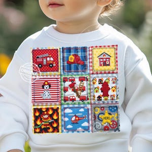May include: White sweatshirt featuring a patchwork design with fire department-themed squares. Each square showcases a different element, including a fire truck, Dalmatian, firefighter, and the word "HERO". The design incorporates red, yellow, blue, and green colors.