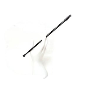 May include: A black hair accessory, likely a hairpin or hair stick, against a white background. The accessory has a long, slender shaft with a rounded tip on one end and a textured design on the other.