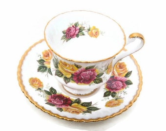 Taza y platillo vintage de porcelana fina Paragon: rosas rosas, ribete de oro de 24 quilates.