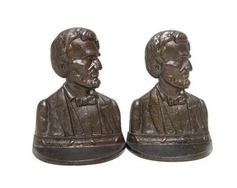 Suportes para livros vintage de 1927 com busto de Abraham Lincoln: decoração presidencial em cobre e bronze.