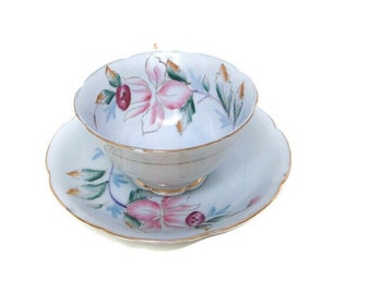 Vintage Japanese Porcelain Teacup and Saucer Hand Painted Blue and Pink Floral Made In Japan