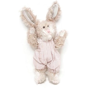 May include: A plush bunny toy with long, floppy ears and a pink nose. The bunny wears striped overalls in shades of pink and white. The toy has a soft, furry texture and is standing upright.