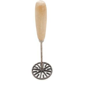 May include: A potato masher with a light brown wooden handle and a circular, dark gray metal head. The head has a decorative, openwork design. The masher is designed for kitchen use.