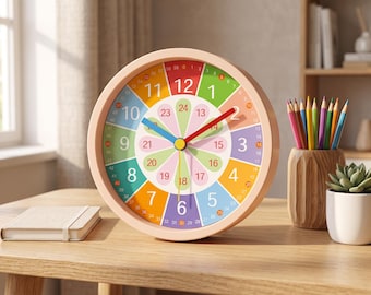 May include: A round wall clock with a light peach frame featuring a colorful face. The dial displays numbers 1 through 12 in large font, with an inner ring showing numbers 13 through 24 in petal shapes. It has red, blue, and yellow clock hands.