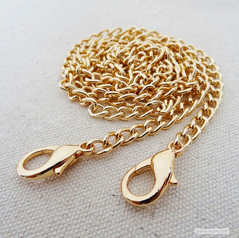 clear purse with gold chain