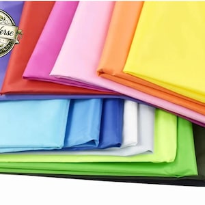May include: A collection of folded fabric sheets in various solid colors including yellow, orange, pink, red, purple, light blue, white, lime green, and black. A circular logo in the top left corner features the text Craft Verse ART & ETC.