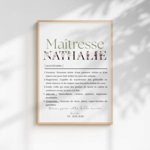May include: A framed print with the word "Ma&icirc;tresse" in a green font, and the name "Nathalie" in a black font with floral accents. The print includes a definition and adjectives in French, with a handwritten note at the bottom.