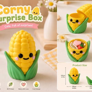 May include: A yellow corn-shaped surprise box with a smiling face and green leaves. The box is 11.8 cm wide and 14.5 cm tall. The text "Corny Surprise Box" is displayed above the box, with the words "Cute. Full of surprises!" below.