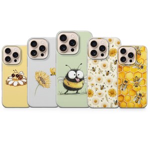 May include: Five phone cases with bee-themed designs. The cases feature illustrations of bees, sunflowers, and honeycomb patterns in yellow, white, and green. Each case has a clear border and a camera cutout.
