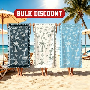 May include: Three beach towels with a California theme are held up on a sandy beach. The towels are in shades of blue, white, and teal, each featuring a white border and illustrations of palm trees, cocktails, and seashells. The text "Bulk Discount" is at the top.