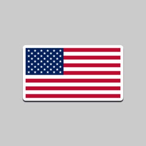May include: A rectangular sticker featuring the United States flag. The flag has a blue canton with white stars and red and white stripes. The sticker has a white border and is set against a gray background.