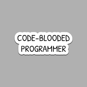 May include: A white sticker with the text "CODE-BLOODED PROGRAMMER" in black, sans-serif font. The sticker has a white border and is set against a gray background. The text is in a bold, easy-to-read style.