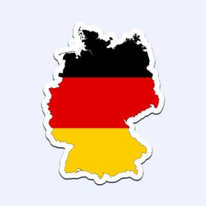 May include: A sticker in the shape of Germany, featuring the German flag's black, red, and yellow colors. The sticker has a white border and is set against a light blue background. The black portion represents the northern part of Germany.