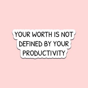 May include: A white sticker with a black border and the text "YOUR WORTH IS NOT DEFINED BY YOUR PRODUCTIVITY" on a light pink background. The sticker has a rounded, cloud-like shape.