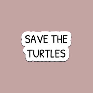 May include: A white sticker with the words "SAVE THE TURTLES" in black, on a muted rose background. The text is in a bold, sans-serif font, and the sticker has a rounded, cloud-like shape.