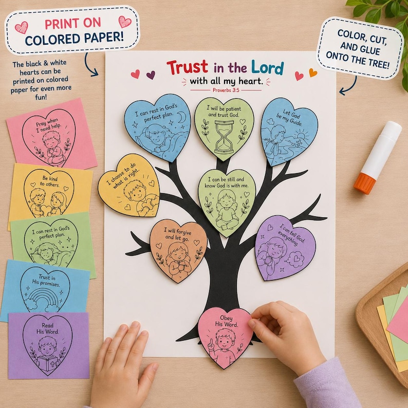 May include: A paper craft activity featuring a white sheet with a black tree illustration and the text Trust in the Lord with all my heart. Several colourful heart-shaped cutouts with black line drawings and text are attached to the tree branches.